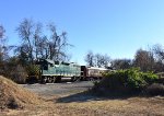 GP38-2 # 2003 sneaks up from behind the woods a little south of Marvin L. Watson Memorial Park 